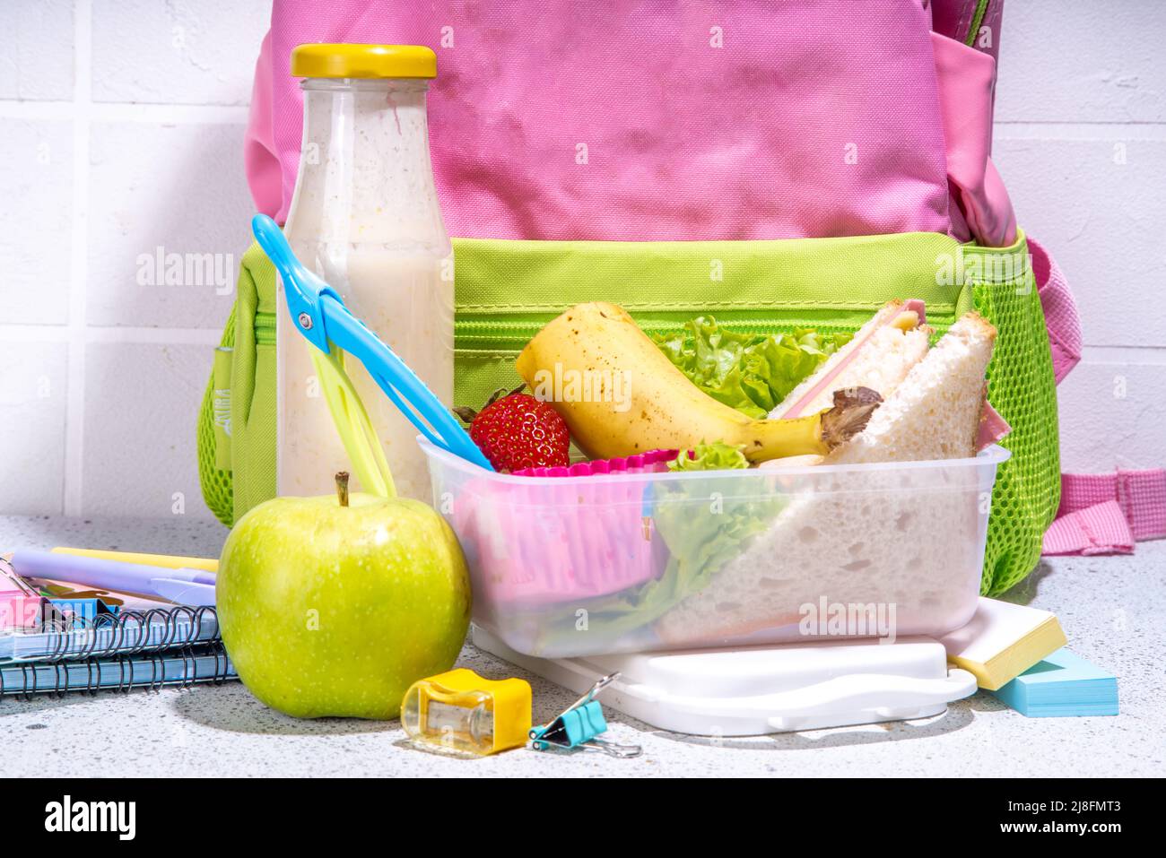 Healthy school lunch box sandwich, vegetables, fruit, nuts and yogurt