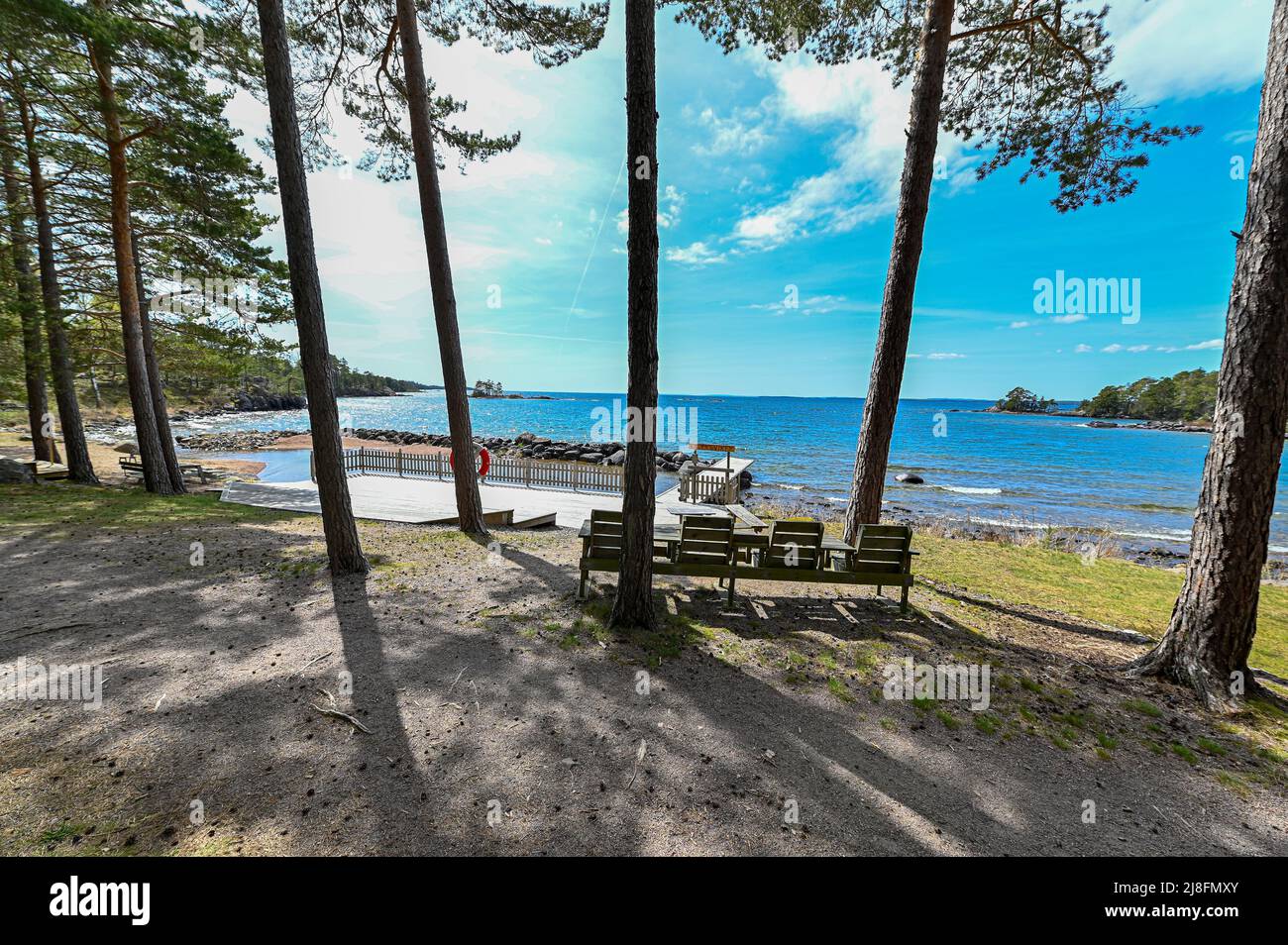 standing on path overlooking nice place for a bath in lake Vattern Sweden Stock Photo