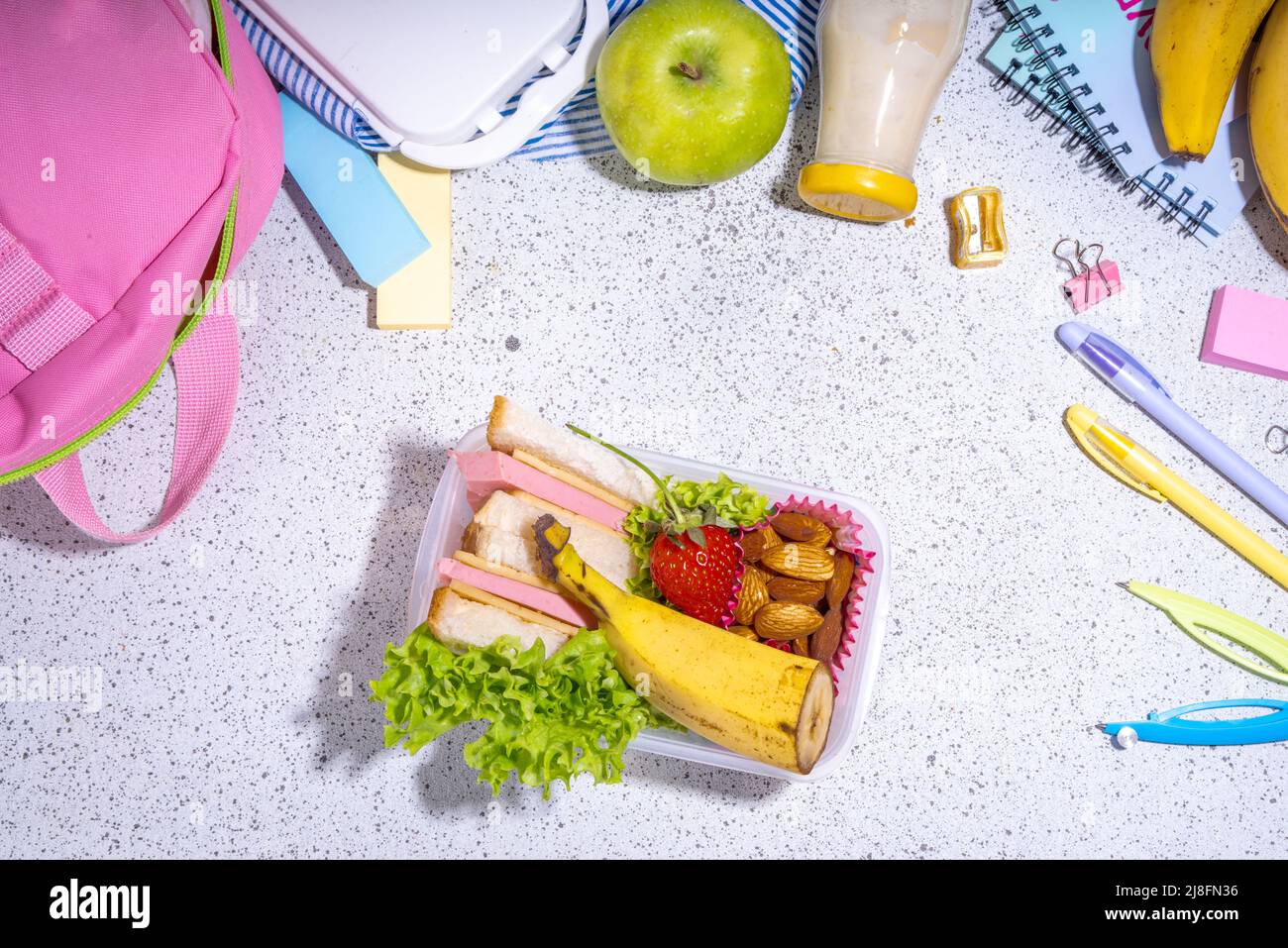 Healthy school lunch box sandwich, vegetables, fruit, nuts and yogurt