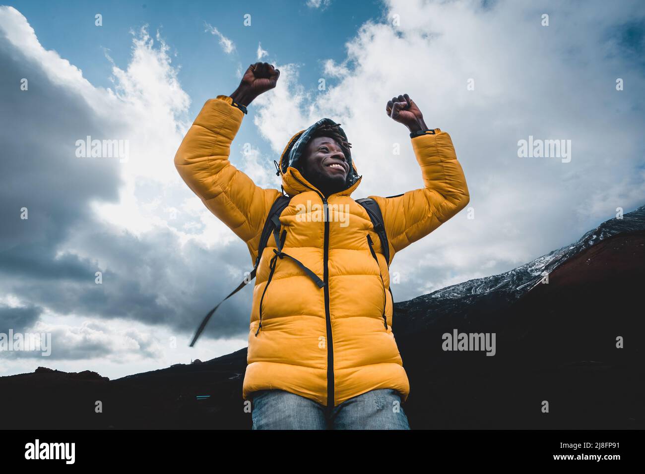 Young hiker in yellow hi-res stock photography and images - Alamy