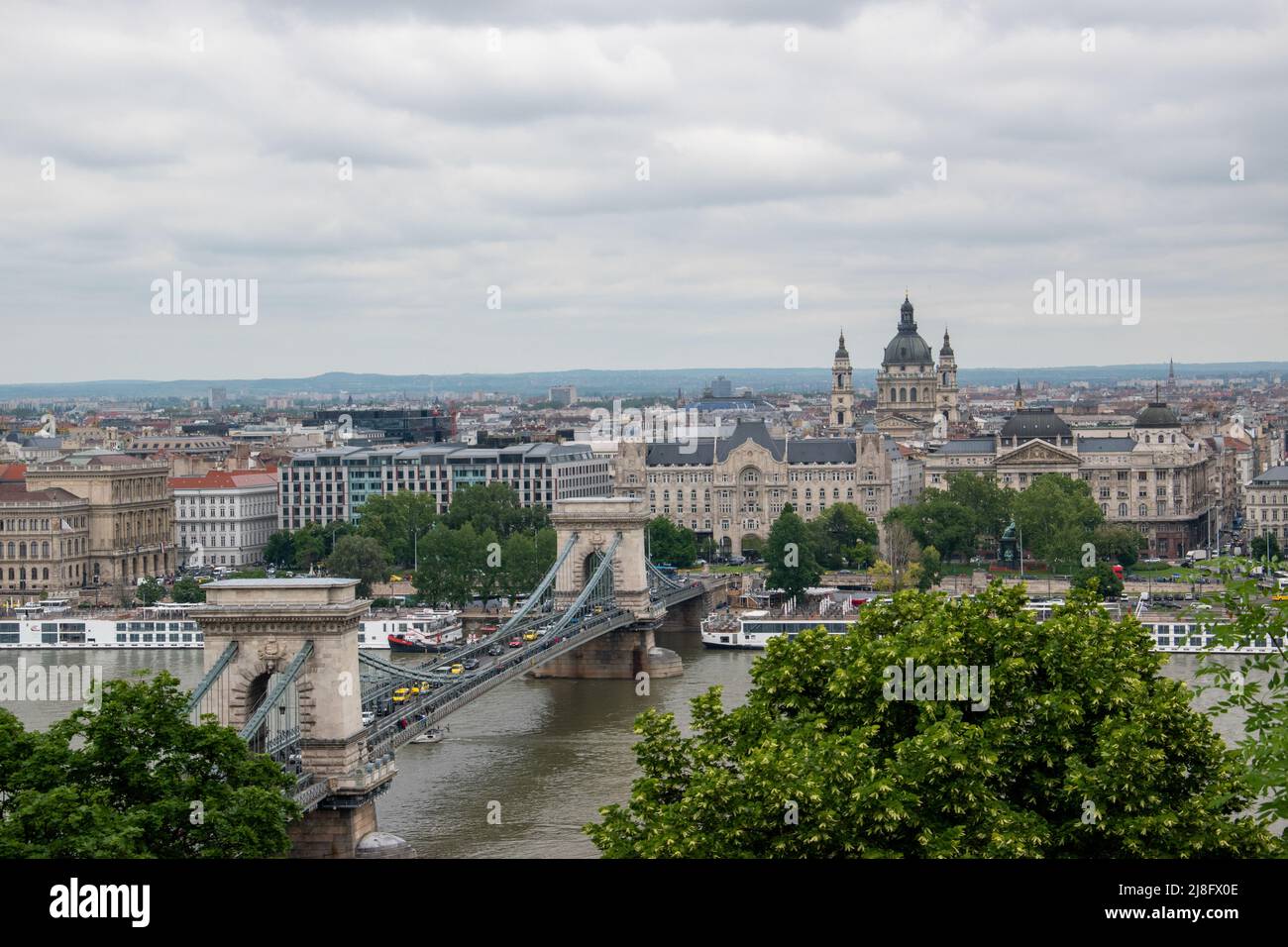 The Széchenyi Chain Bridge crosses the Danube River and connects Buda ...