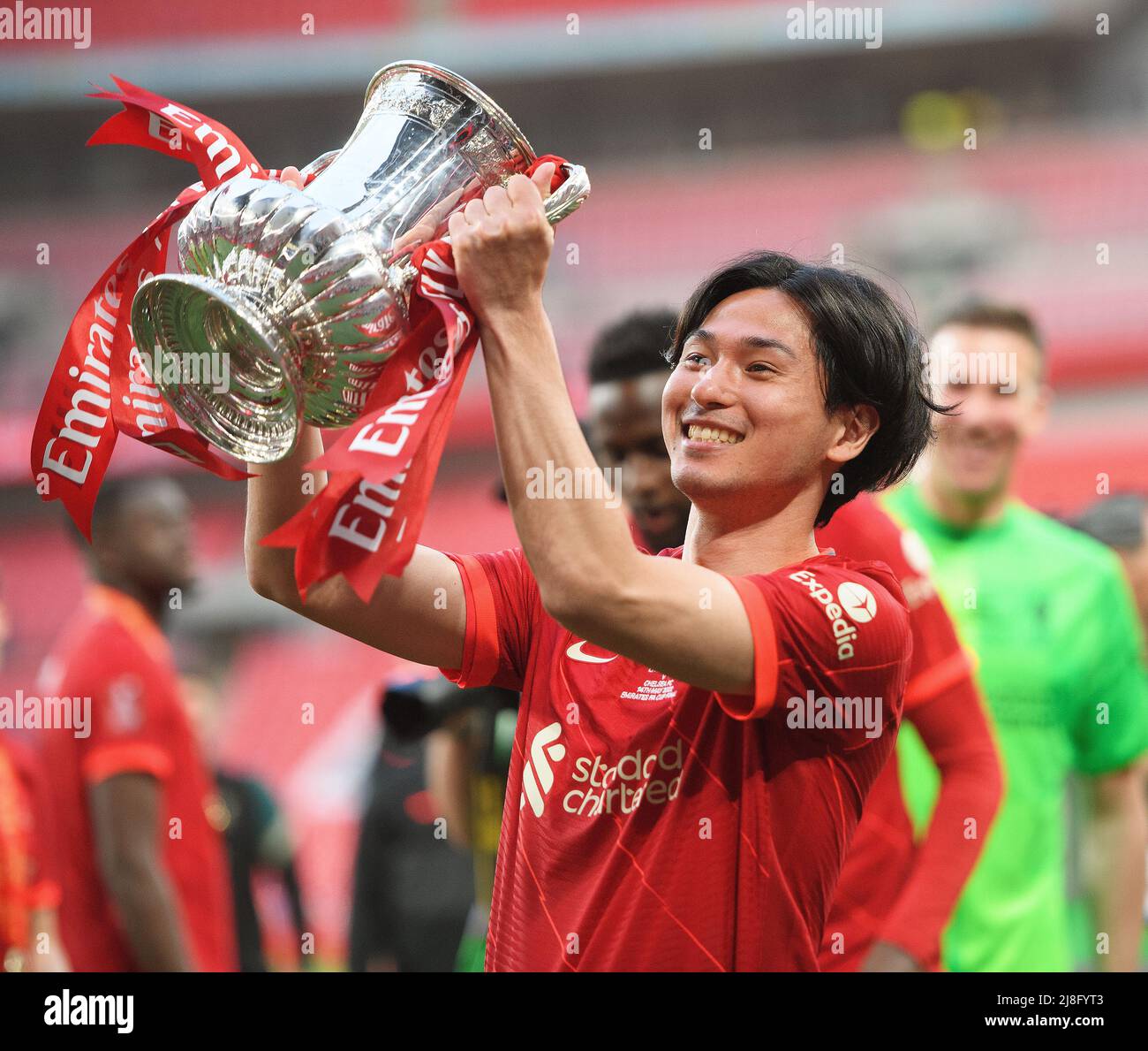 14 May 2022 - Chelsea v Liverpool - Emirates FA Cup Final - Wembley Stadium  Takumi Minamino celebrates with the FA Cup  Picture Credit : © Mark Pain / Alamy Live News Stock Photo