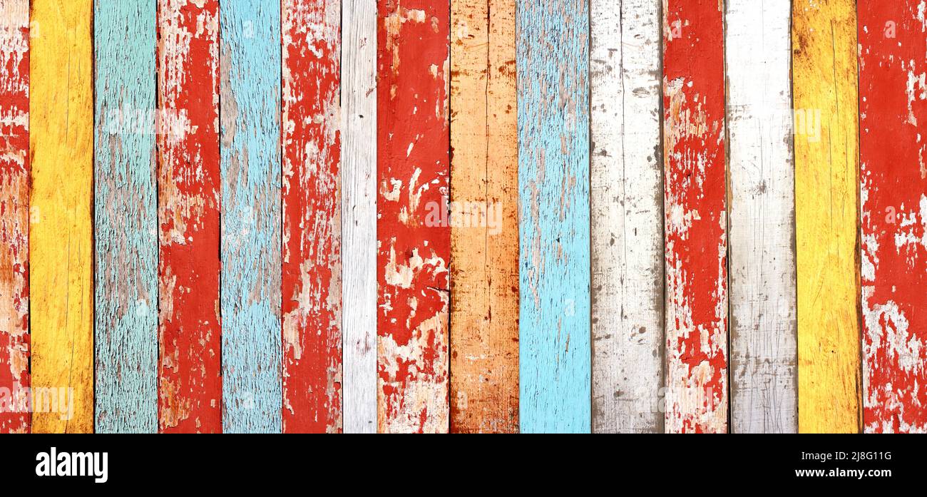 Texture of vintage wood boards with cracked paint of white, red, yellow ...