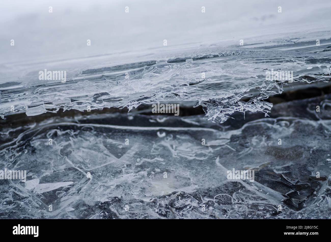 Ice on a big river. Frozen crust on the surface of the water in the trough. Stock Photo