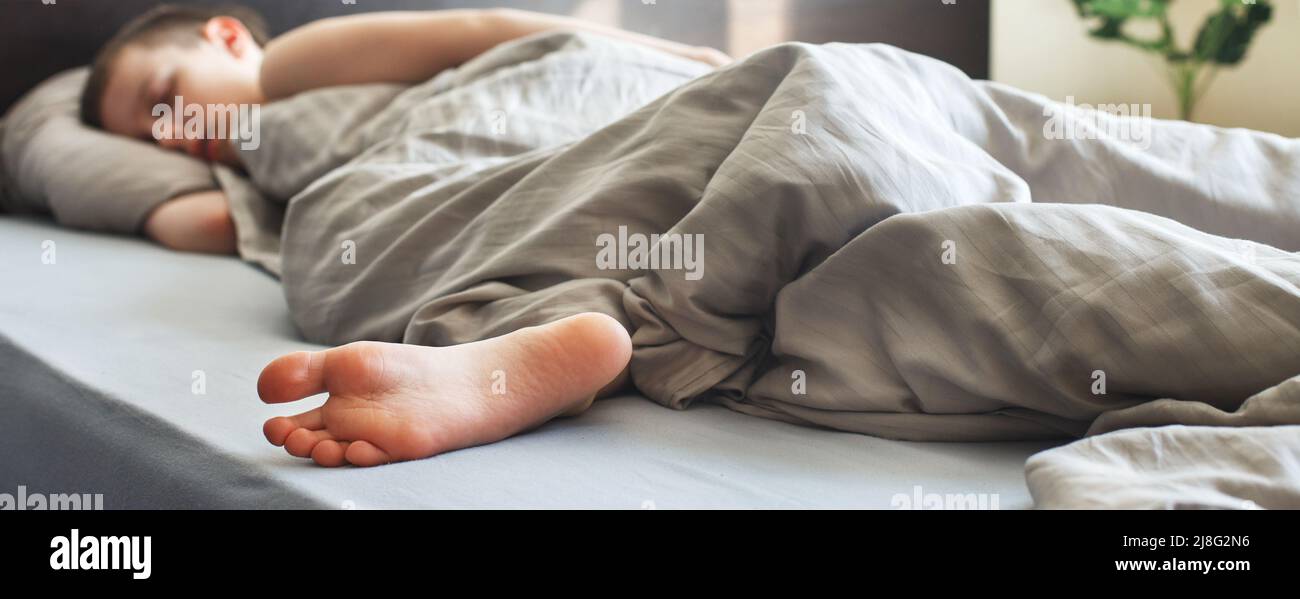 Child sleep feet home hi-res stock photography and images - Alamy