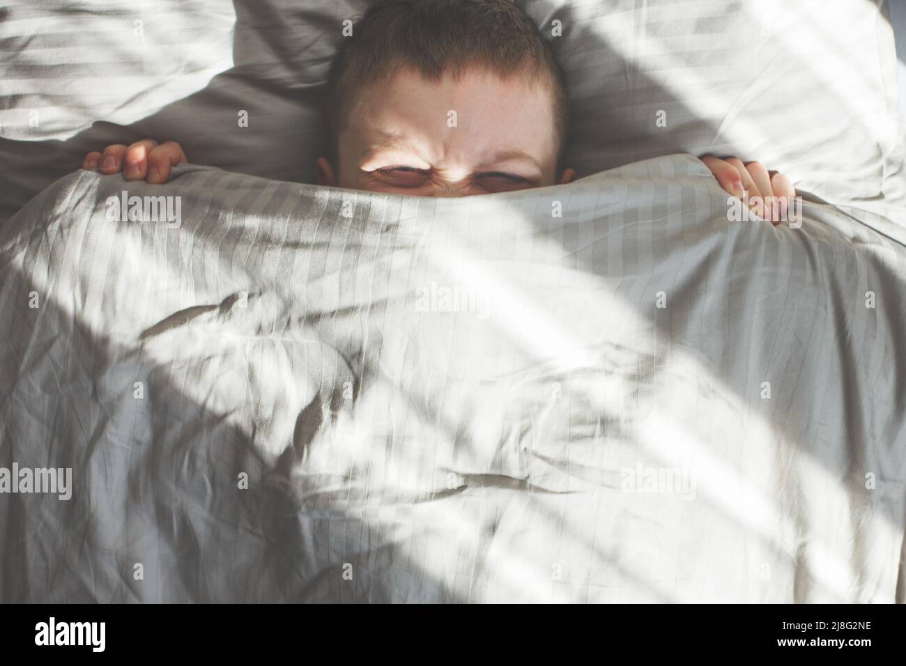 Boy covers face hires stock photography and images Alamy