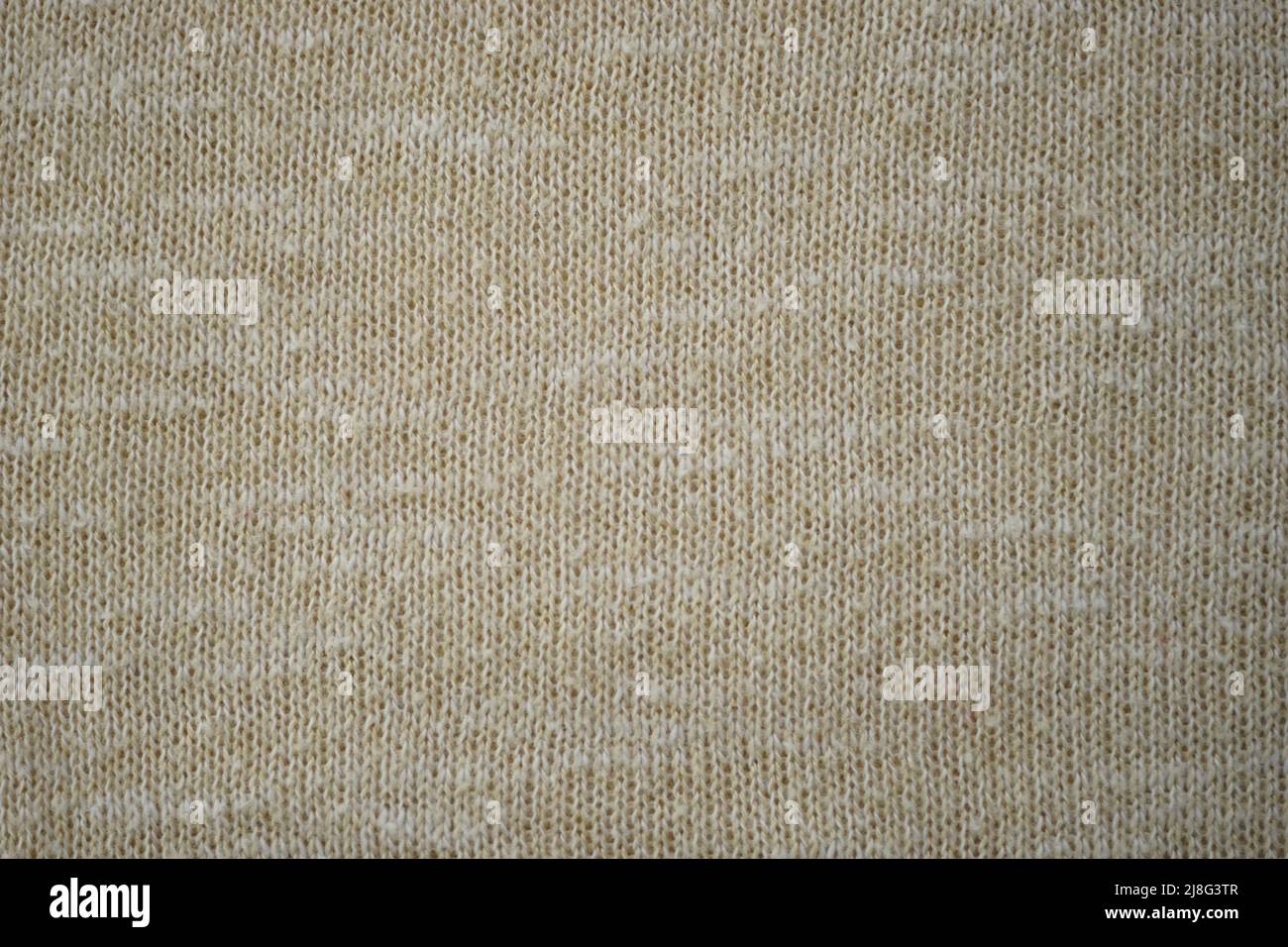 Beige sweater cozy pattern, knitted creamy background. Stock Photo