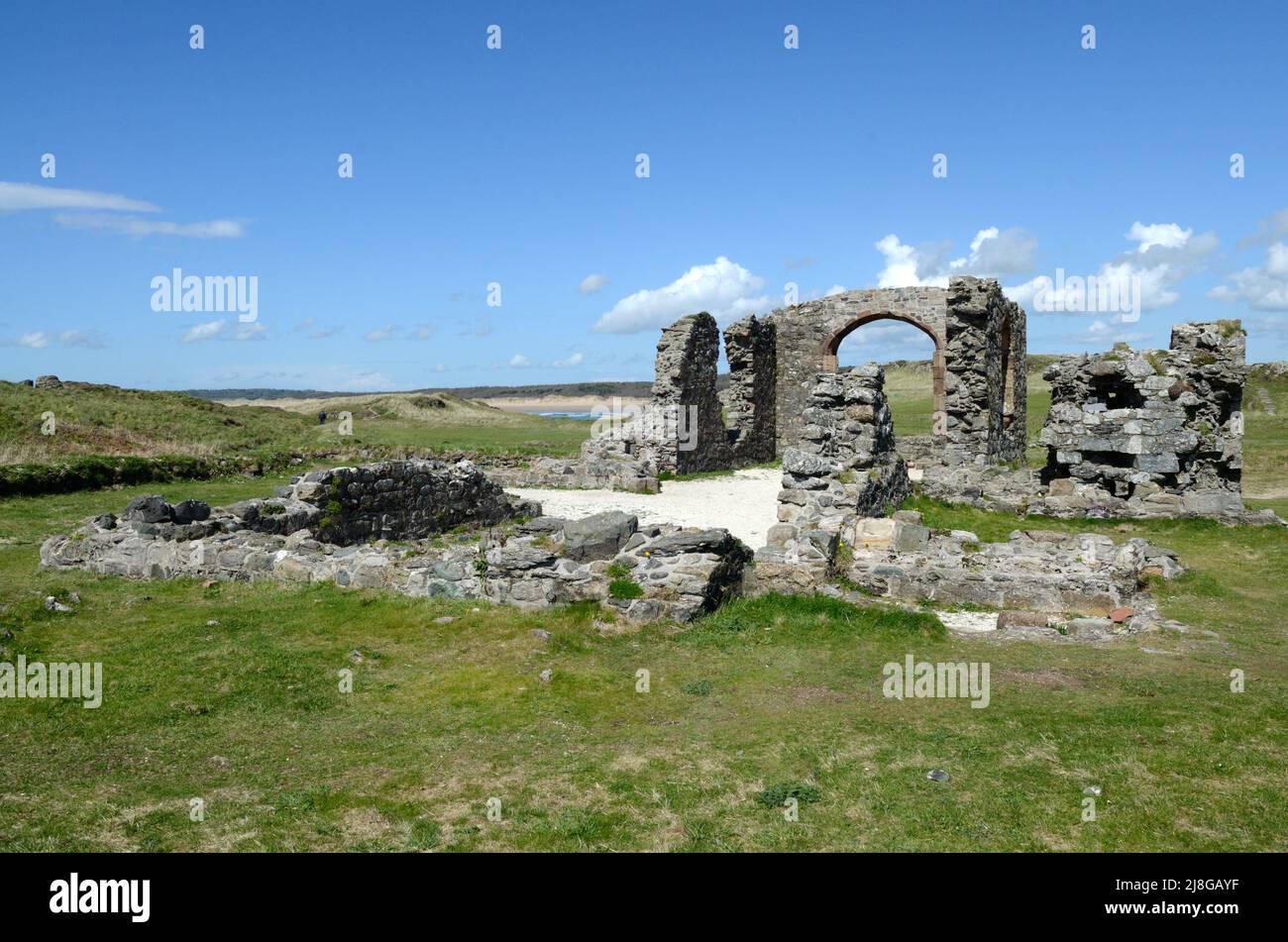 Ruins of the Church of St Dwynwen Ynys Llanddwyn Island Anglesey y Mon Wales Cymru UK Stock Photo