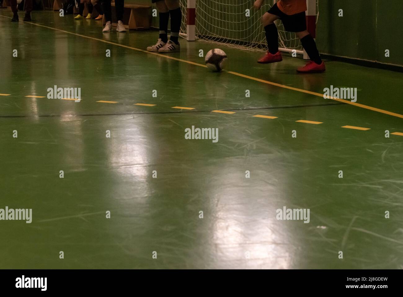 children futsal player taking a throw-in in a match in spain Stock Photo