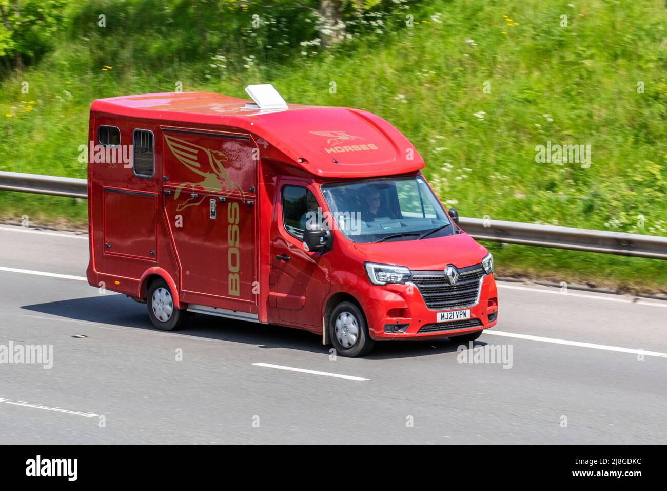 2021 red BOSS Supa-Lite 35 Horsebox, RENAULT MASTER MM35 B-NESS ENGY DCi SA MM35 BUSINESS Energy Quickshift 2298cc Diesel Van; driving on the M6 Motorway, Manchester, UK Stock Photo