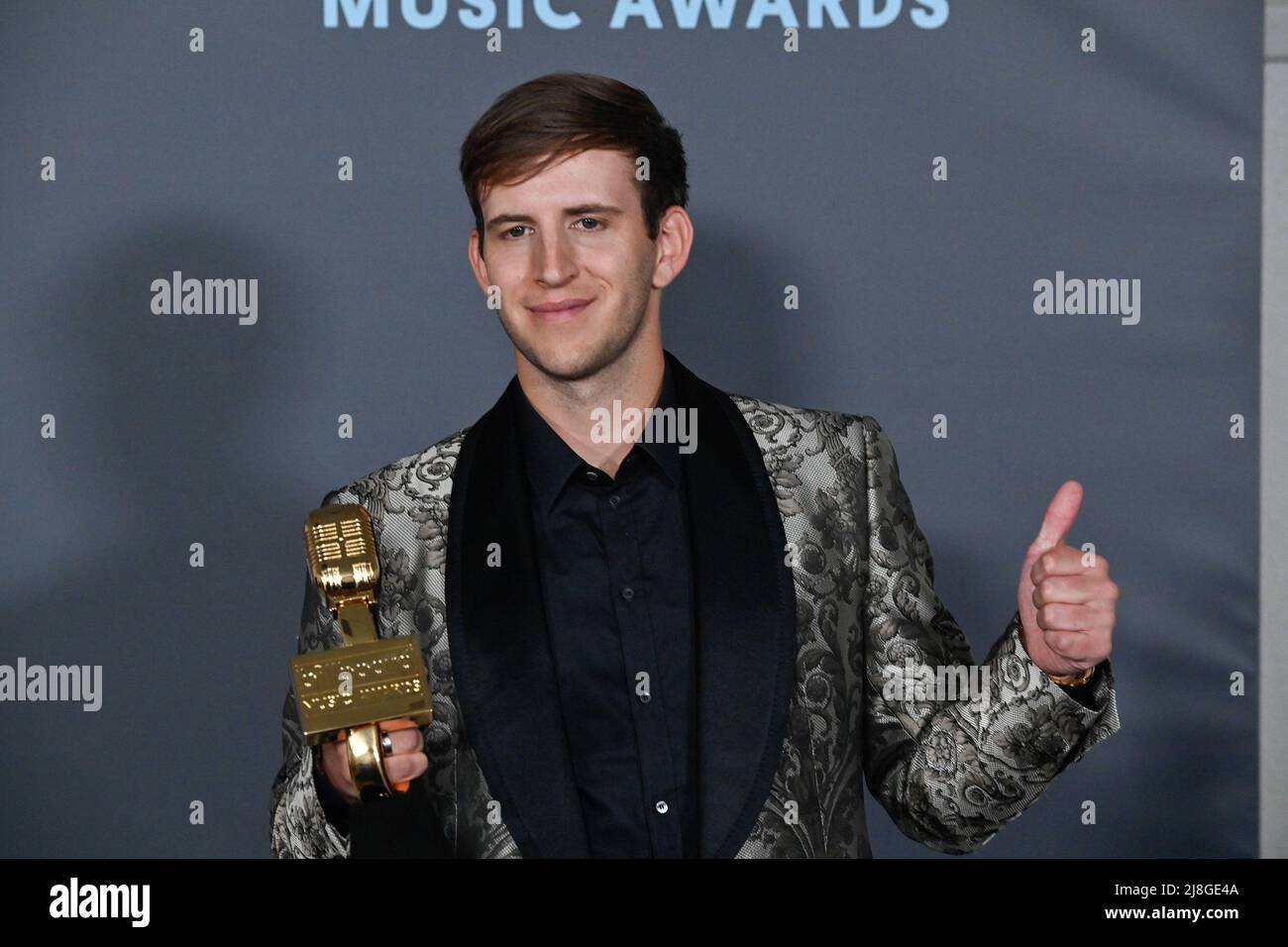Las Vegas, United States. 16th May, 2022. Illenium appears backstage with his award during the annual Billboard Music Awards held at the MGM Grand Garden Arena in Las Vegas on May 15, 2022. The musician was honored with Top Dance/Electronic Album for 'Fallen Embers'. Photo by Jim Ruymen/UPI Credit: UPI/Alamy Live News Stock Photo