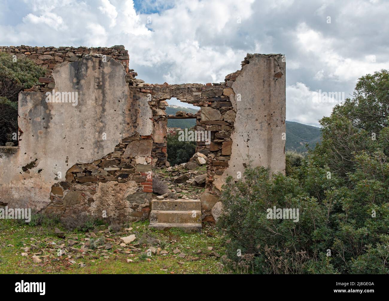 Ruins of house in abandoned mining town of Miniera di Naracauli (Laveria Brassey), Sardinia, Italy Stock Photo
