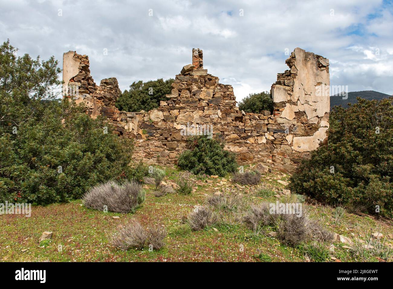 Ruins of house in abandoned mining town of Miniera di Naracauli (Laveria Brassey), Sardinia, Italy Stock Photo