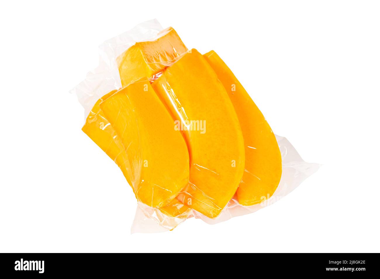 Packed pumpkin slices on an isolated white background Stock Photo