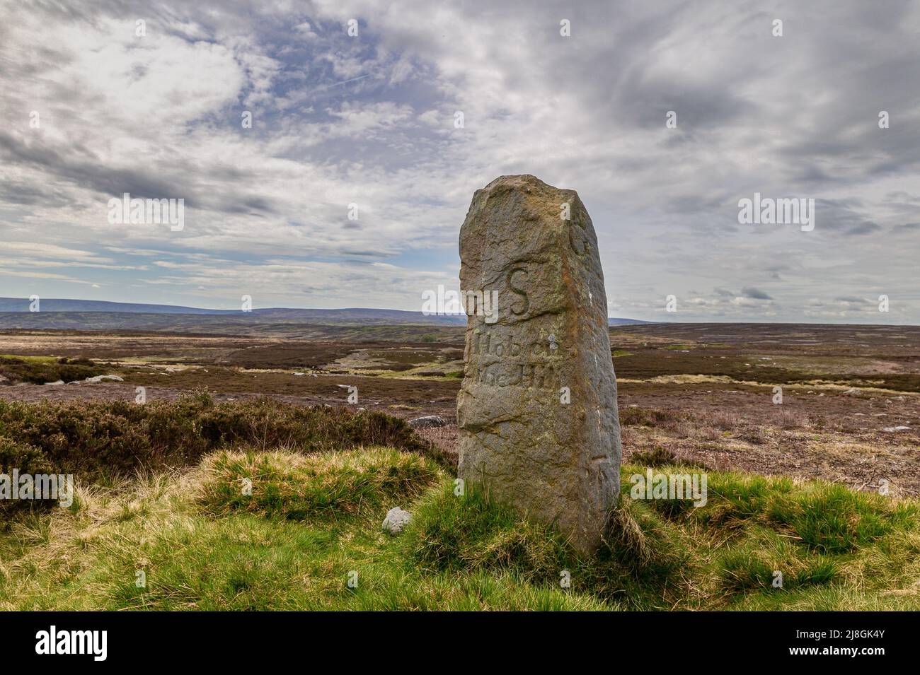 Hob on the Hill an ancient boundary stone sited in an Iron Age Bowl Barrow on North Ings Moor north of Commondale in North Yorkshire Stock Photo