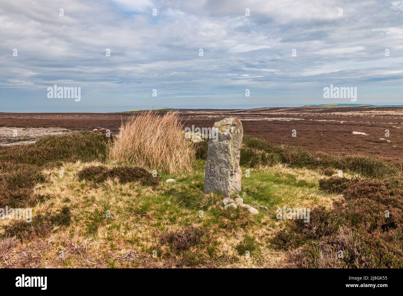 Hob on the Hill an ancient boundary stone sited in an Iron Age Bowl Barrow on North Ings Moor north of Commondale in North Yorkshire Stock Photo