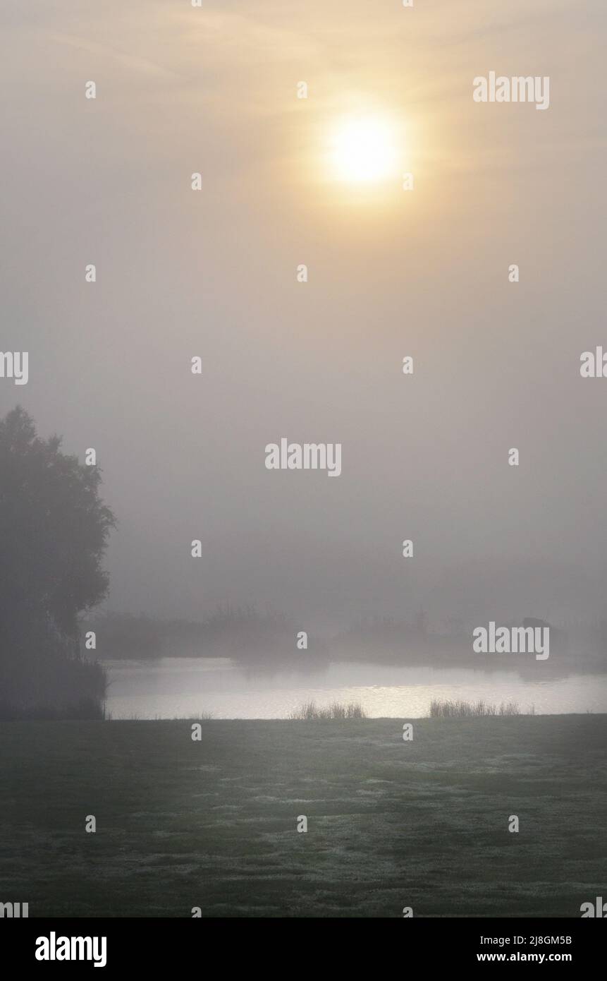 sunrise over misty lake kent england Stock Photo