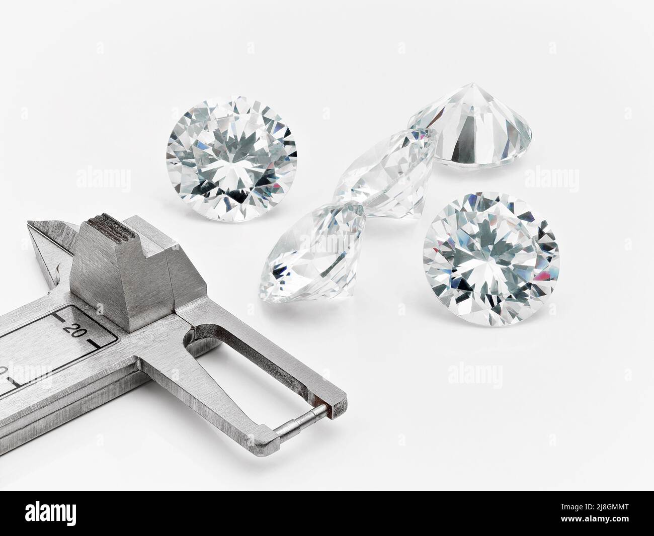 Big Diamonds Photographed with Diamond Measurement Gauge for Assessment of Diamond Size. Stock Photo