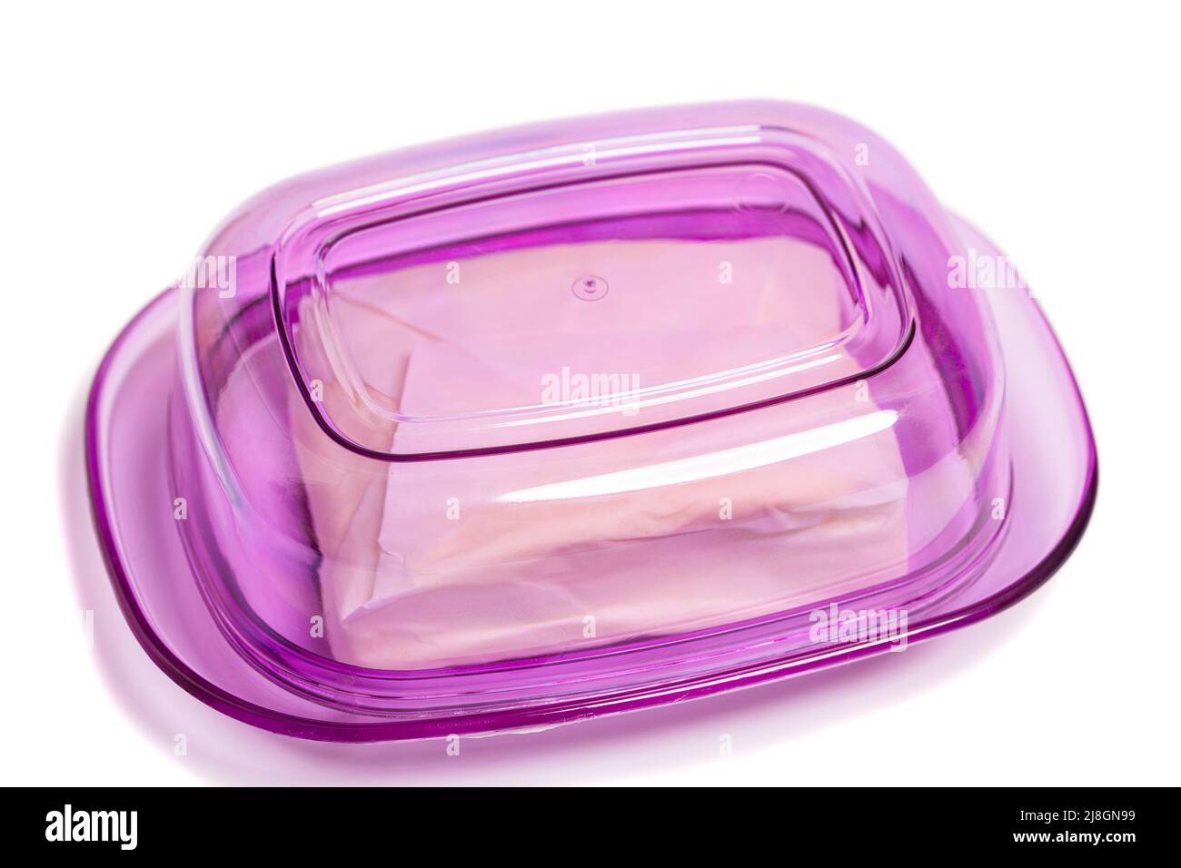 Butter in a plastic butter dish isolate on a white background.top view
