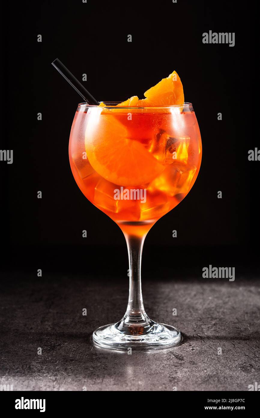 Glass of aperol spritz cocktail on black background Stock Photo