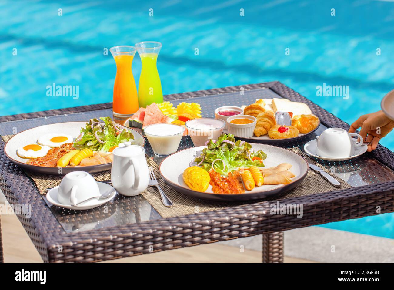 Holiday pool woman waiter hires stock photography and images Alamy