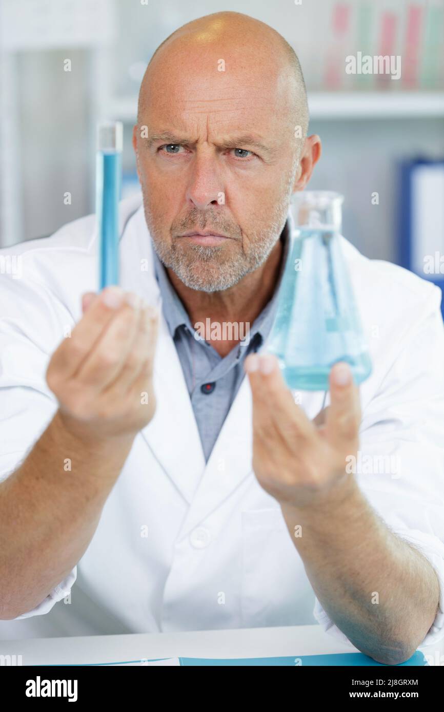 investigator checking test tubes Stock Photo - Alamy