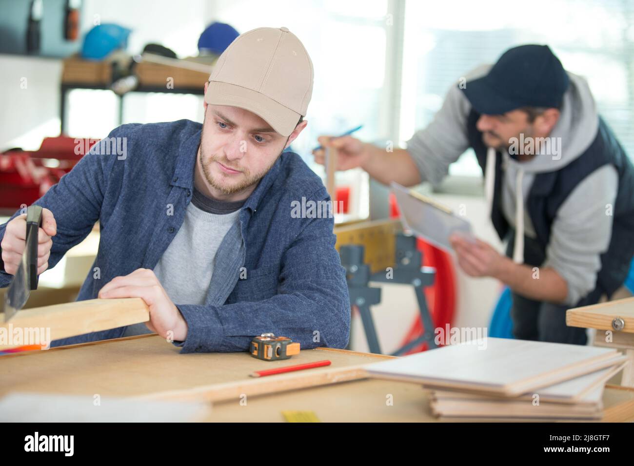 two wood designer working in workshop Stock Photo