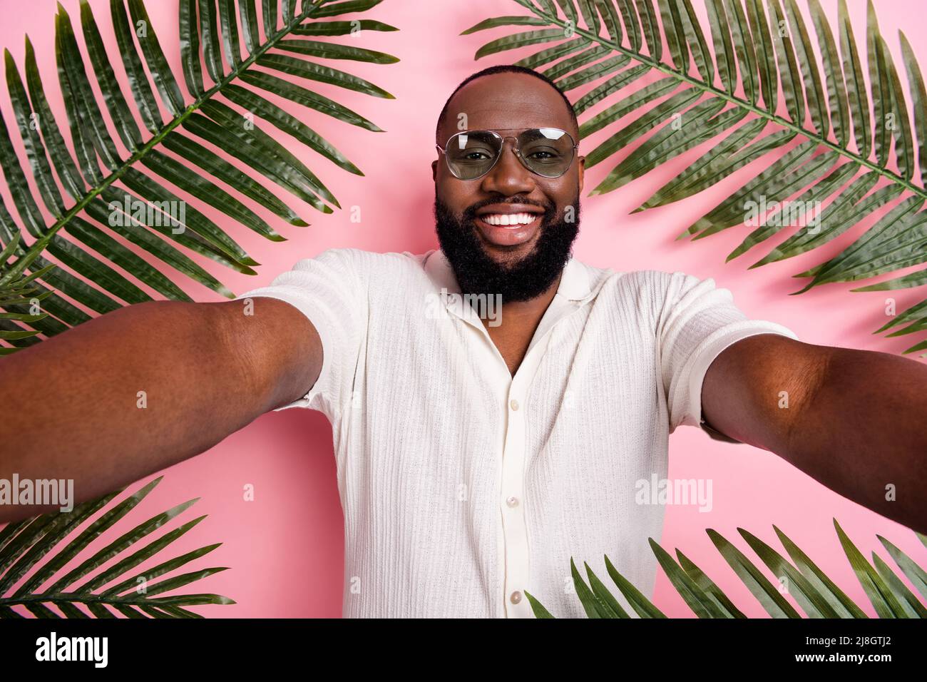 Positive nice person make selfie enjoy free time vacation season isolated on pink color background Stock Photo