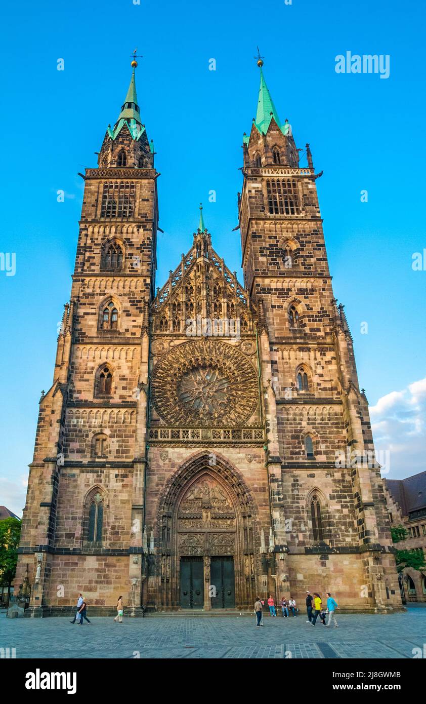 The west facade of the famous St. Lorenz (St. Lawrence), a medieval church in Nürnberg, Germany. The facade is dominated by the two towers, a sharp... Stock Photo
