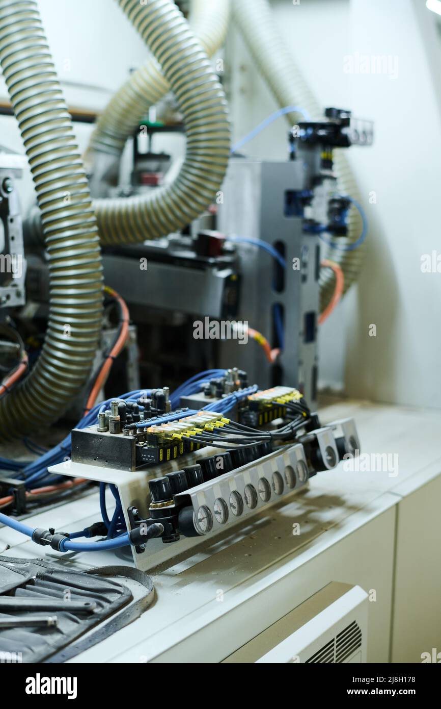 Close-up of machine equipment with indicators and wires in factory Stock Photo