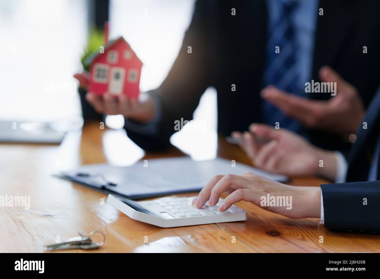Close up Business woman or Real Estate agent explain signing agreement ...