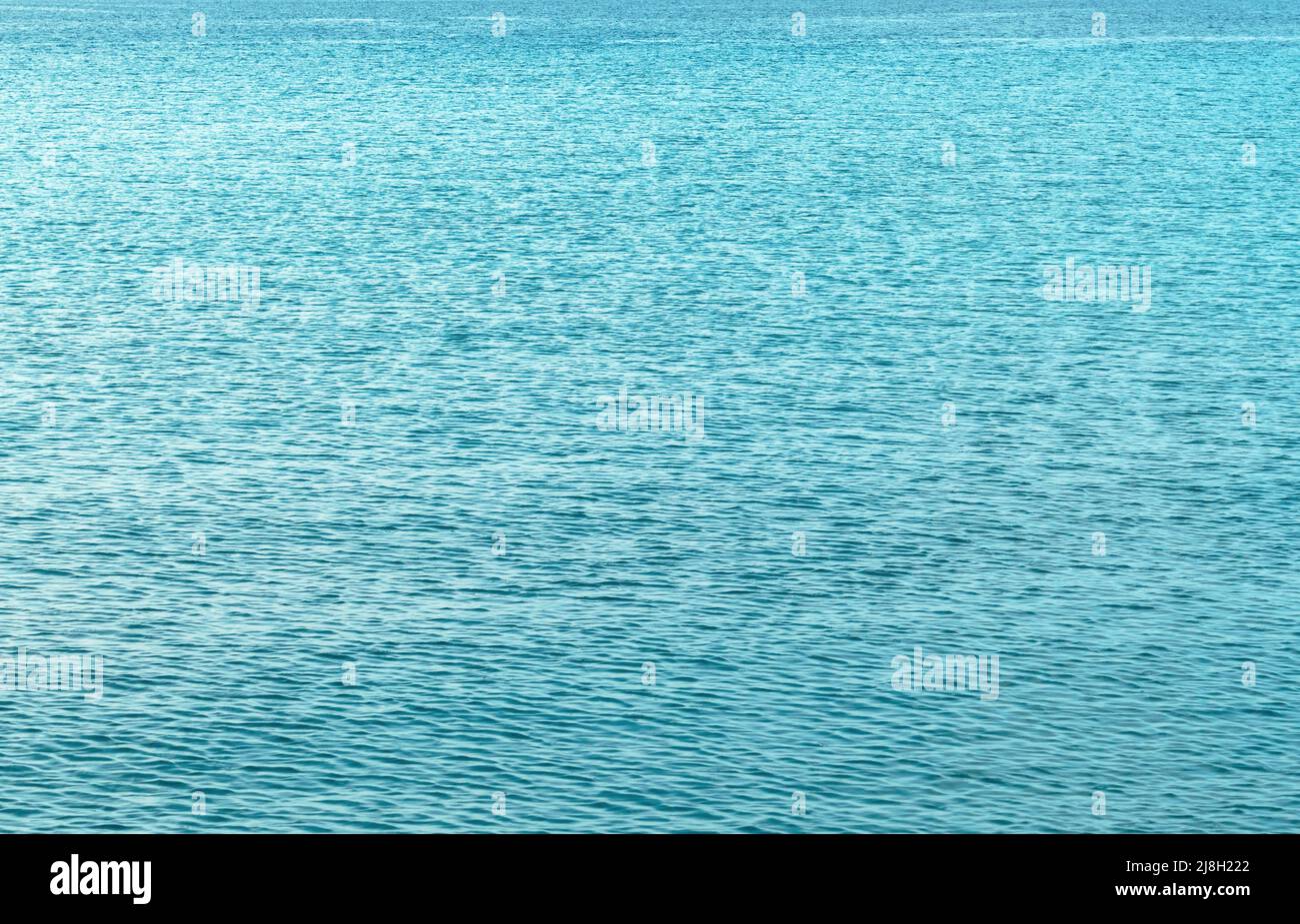 Beautiful deep blue sea water background.Vertical wallpaper of fantastic Mediterranean  sea.Exotic summer vacation tour backdrop.Ocean waves sparkling in the  sun.Bue Adriatic Sea poster - Stock Image - Everypixel