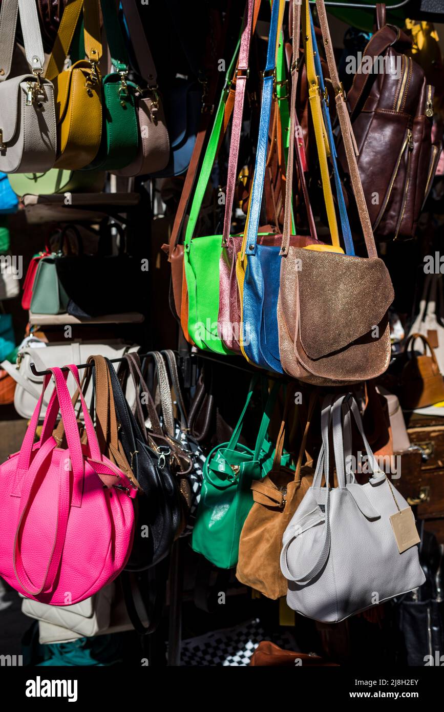 Florence, Tuscany, Italy - April 15, 2022: Leather handbags at the Porcellino Market, Piazza del Mercato Nuovo Stock Photo