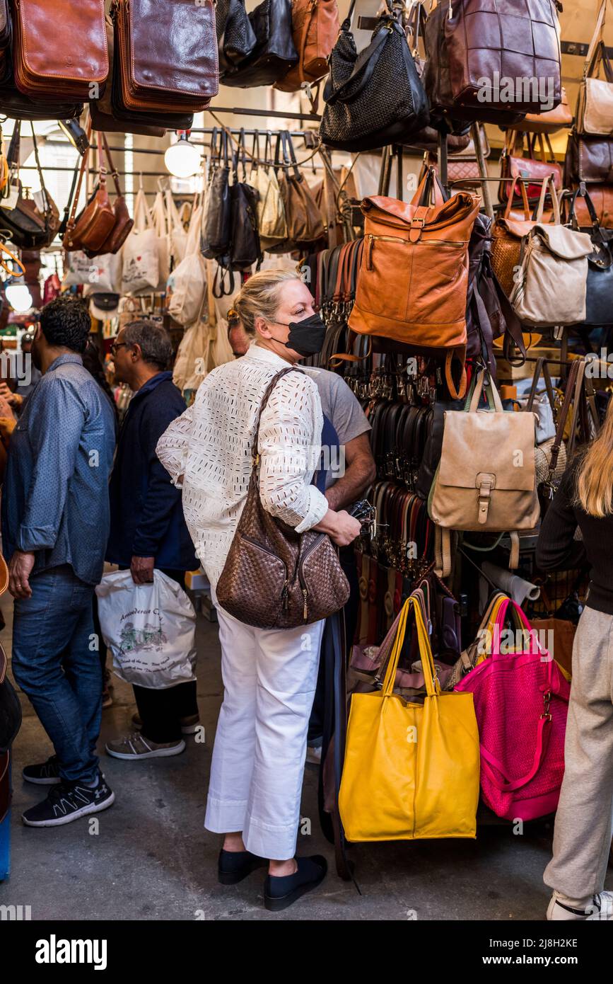 Florence, Tuscany, Italy - April 15, 2022: Shopping for leather goods at the Porcellino Market, Piazza del Mercato Nuovo Stock Photo