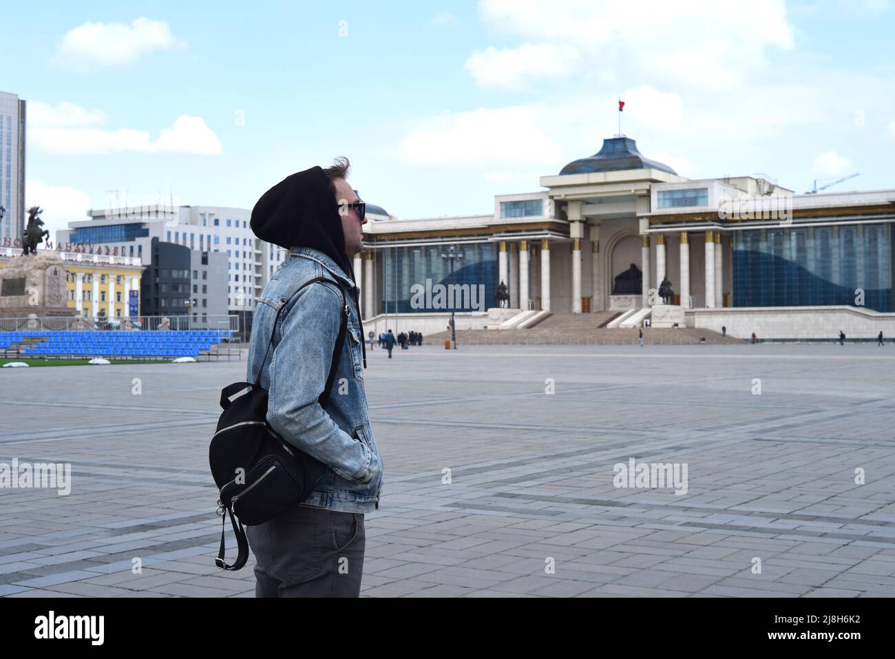 Young tourist man travelling in Ulaanbaatar of Mongolia. sukhbaatar square Stock Photo