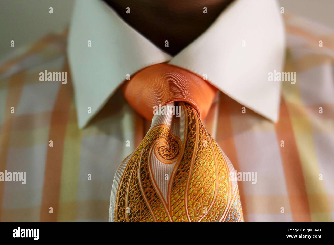 A  black African-American man wearing a peach colored necktie Stock Photo