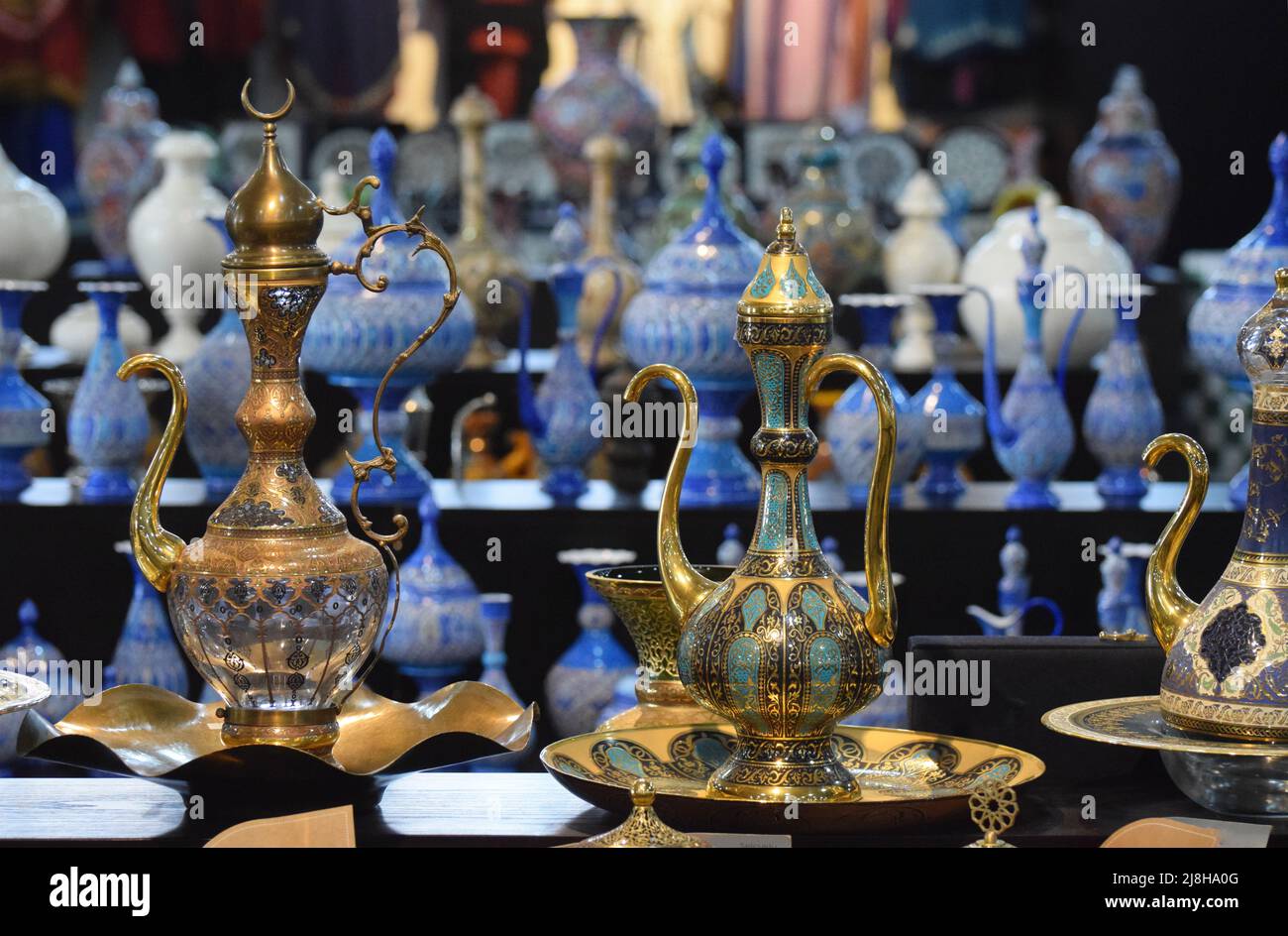 Beautiful ornate Arabian style coffee pots for sale in a tourist shop in Madaba in Jordan Stock Photo