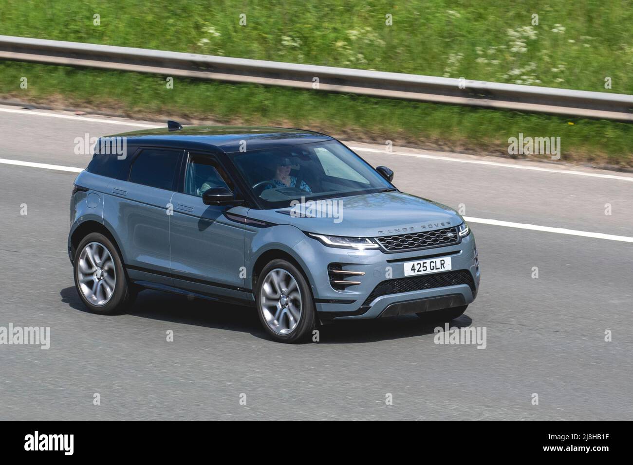 2019 grey LAND ROVER EVOQUE FIRST EDITION ED A R-DYNAMIC HSE 1999 cc DIESEL; driving on the M61 Motorway, Manchester, UK Stock Photo
