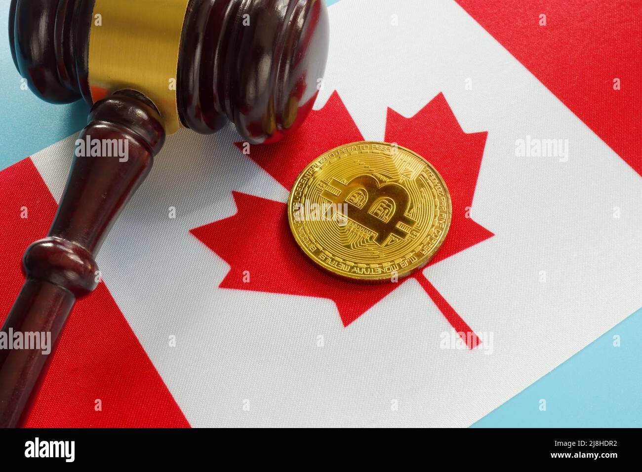Cryptocurrency legislation in Canada. Flag and gavel. Stock Photo