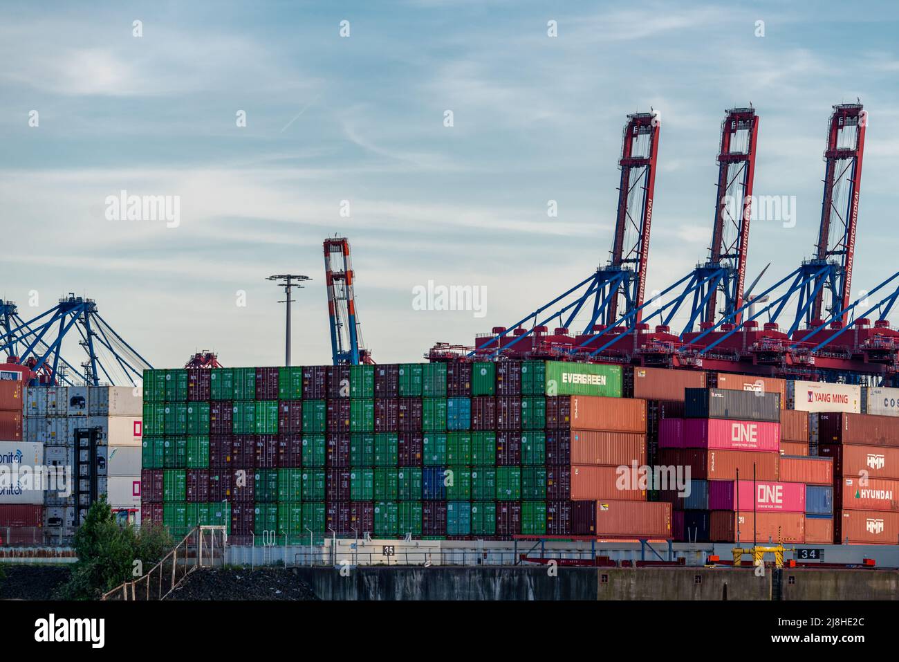Hamburg, Germany - 05 15 2022: closeup of stacked containers at the container terminal burchardkai in the port of hamburg Stock Photo