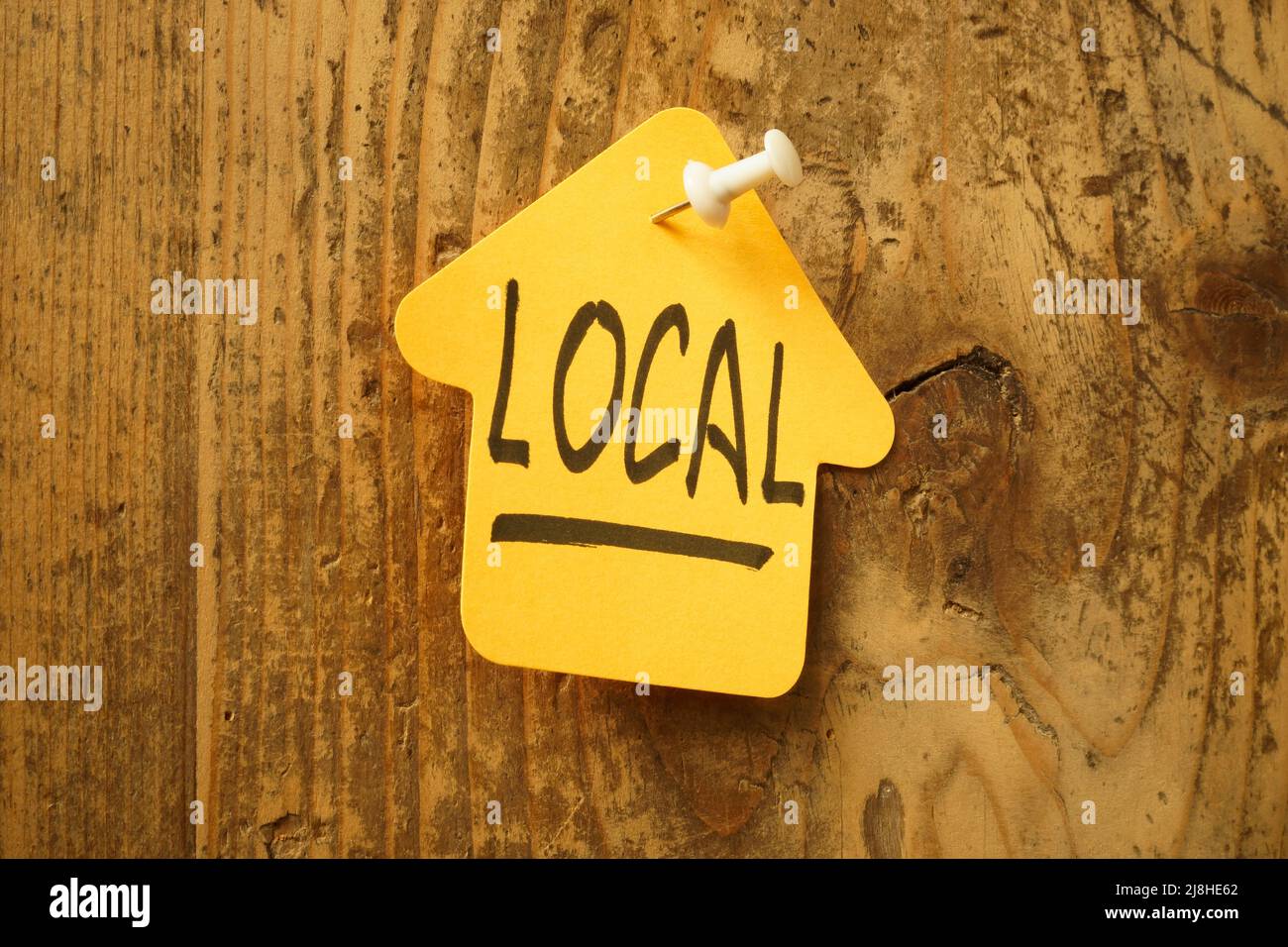 Sticker in the form of a house and the inscription local. Stock Photo