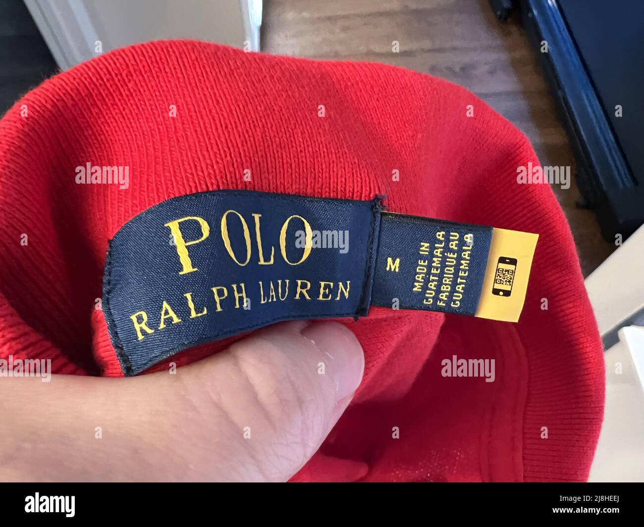 A QR code is sewn into the label of a garment from Ralph Lauren, providing care instructions via a phone camera scan, Lafayette, California, February 17, 2022. Photo courtesy Tech Trends. Stock Photo
