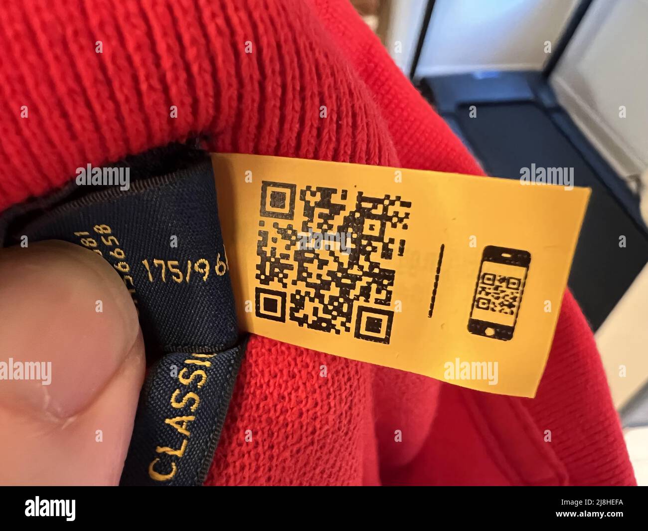 A QR code is sewn into the label of a garment from Ralph Lauren, providing  care instructions via a phone camera scan, Lafayette, California, February  17, 2022. Photo courtesy Tech Trends Stock