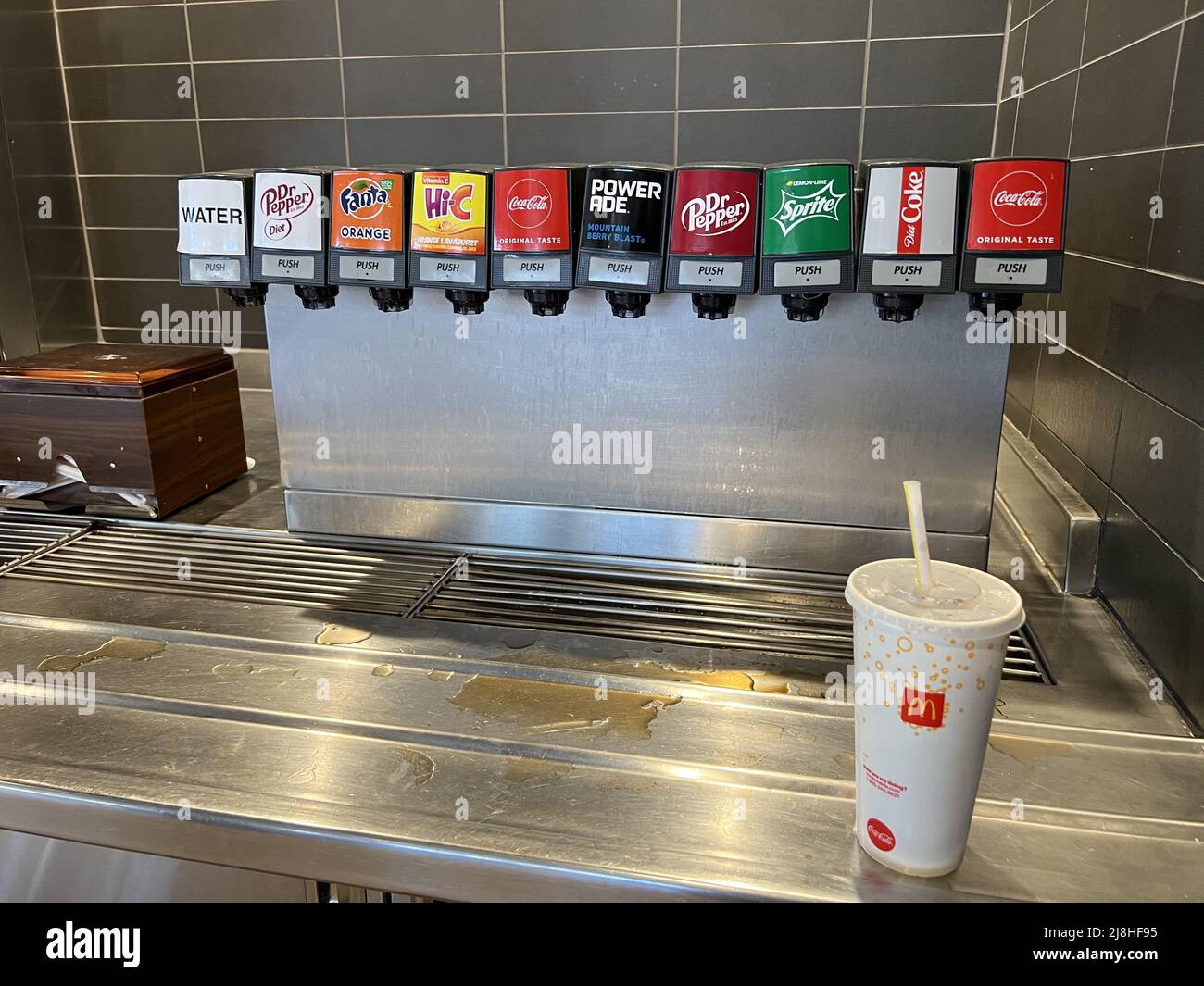Soda fountain with drink cup visible at McDonald's restaurant in