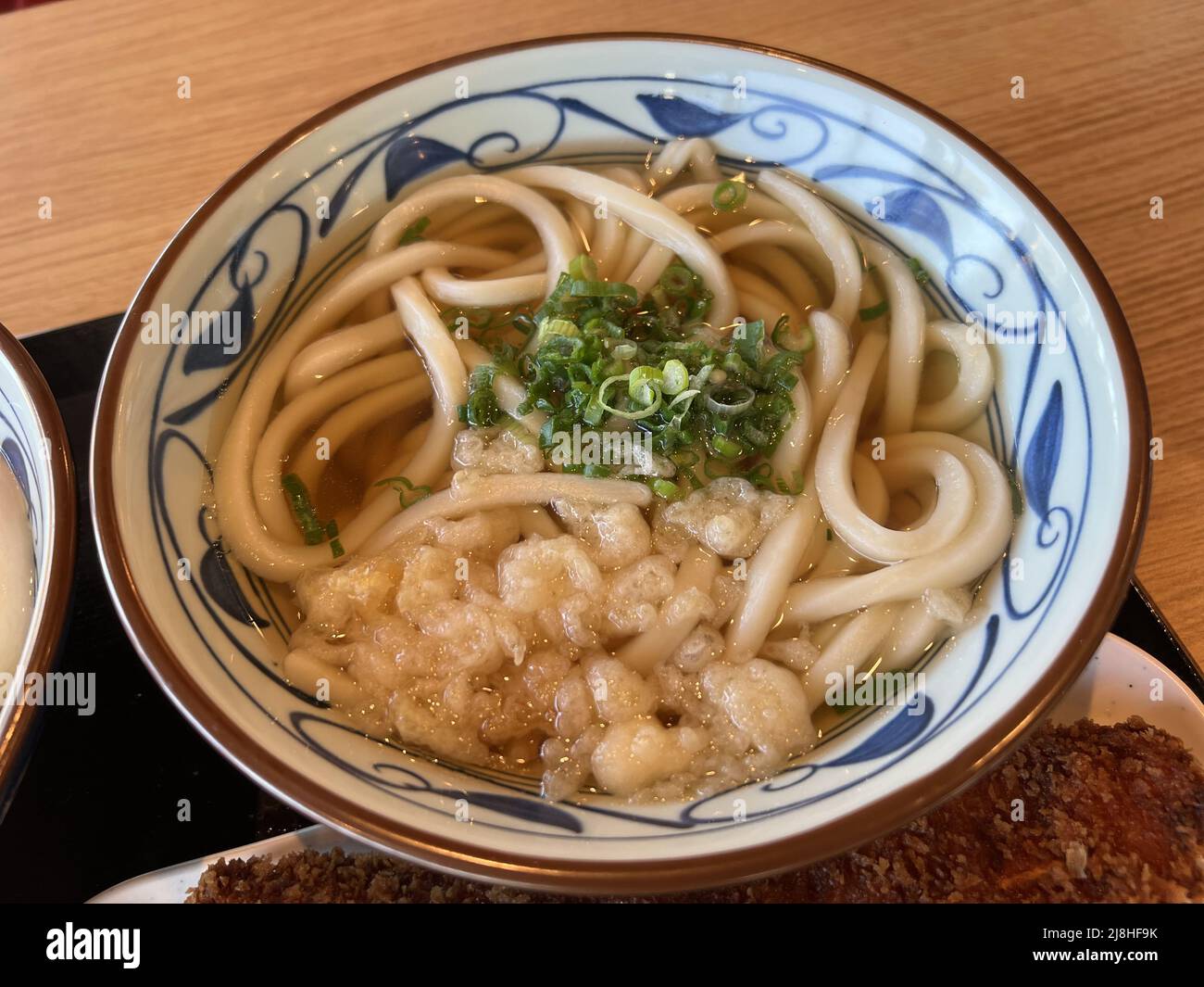 Closeup of bowl of udon soup during grand opening of Marugame Udon at
