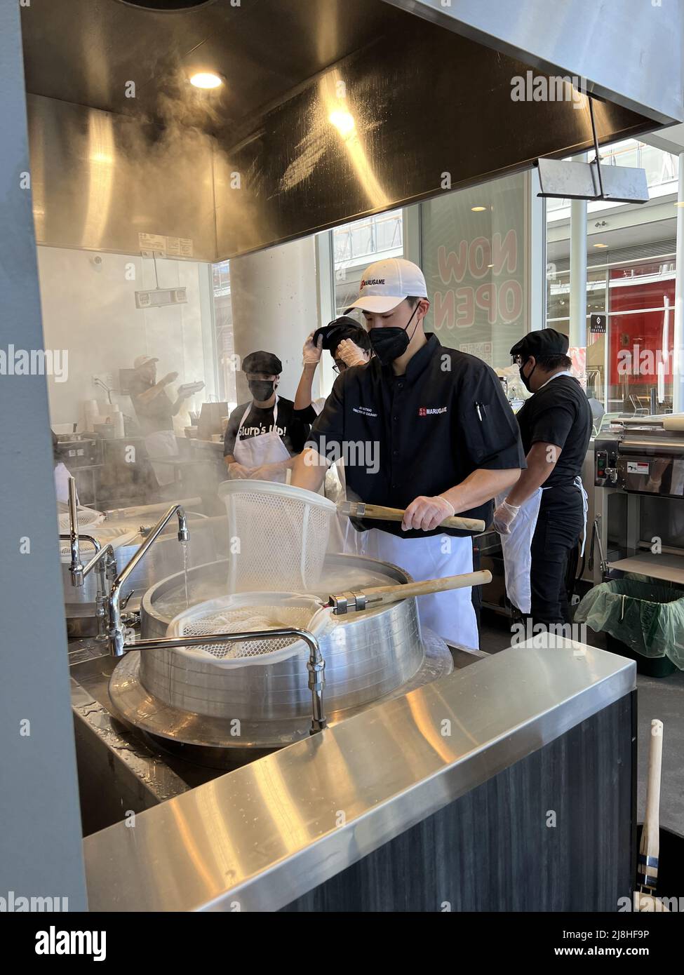 Chefs cook udon noodles during grand opening of Marugame Udon at City