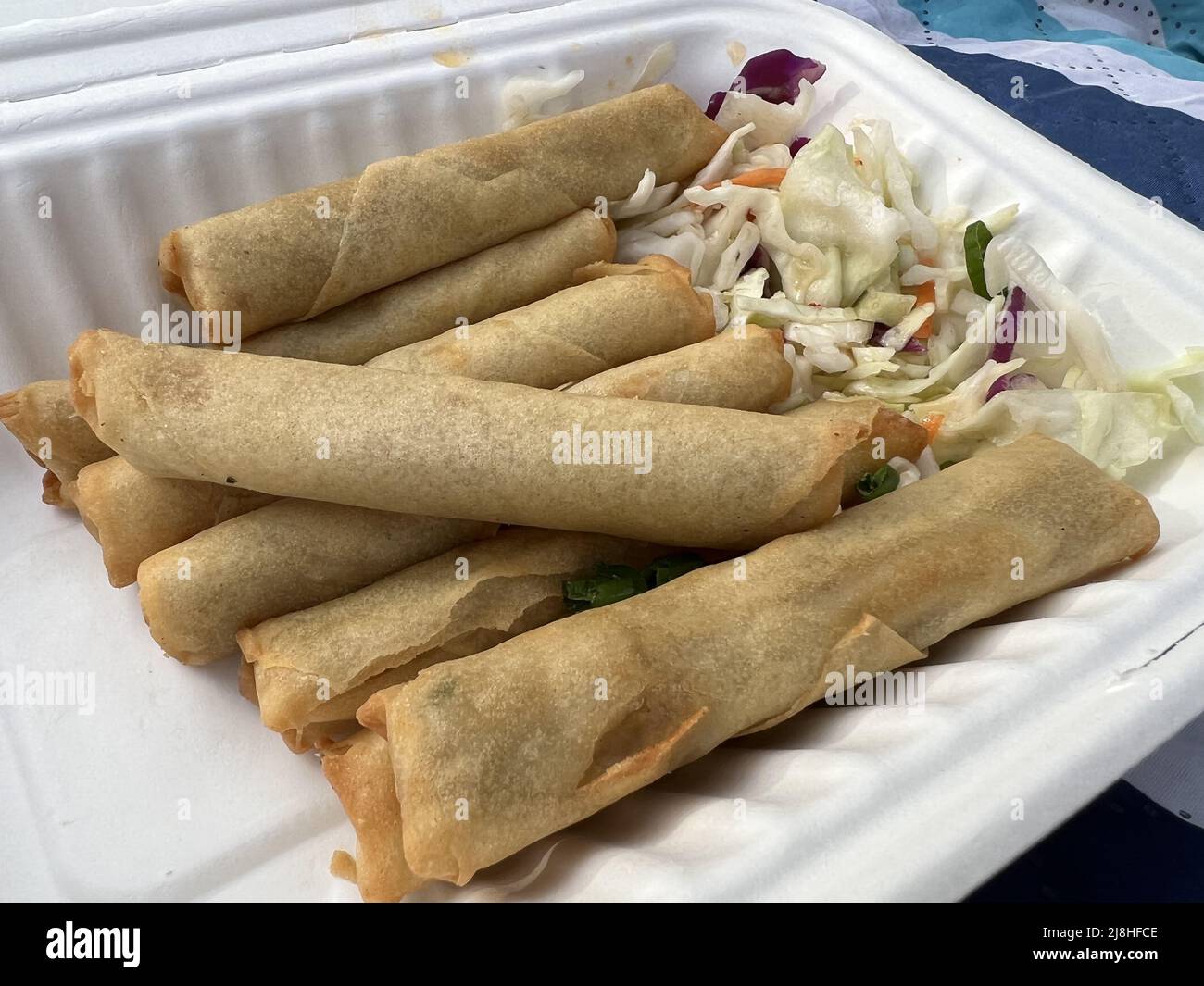 Take-out lumpia, or Filipino spring rolls, from a restaurant popup of the Lumpia Company, Lafayette, California, March 18, 2022. Photo courtesy Sftm. Stock Photo