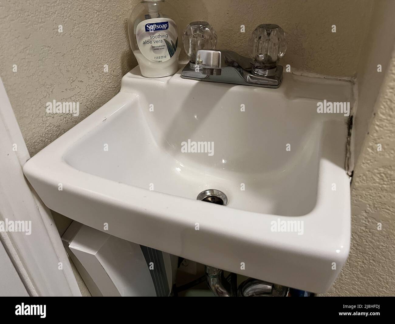 A small sink is visible in a closet converted to a bathroom, Lafayette, California, March 4, 2022. Stock Photo
