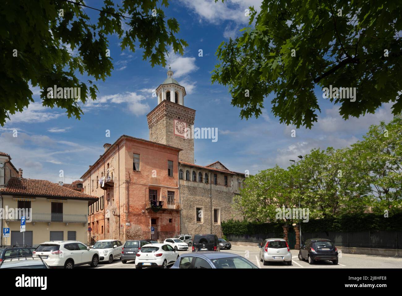 Busca, Cuneo, Italy - May 13, 2022: The Civic Tower with ancient buildings in the historic center of Busca Stock Photo