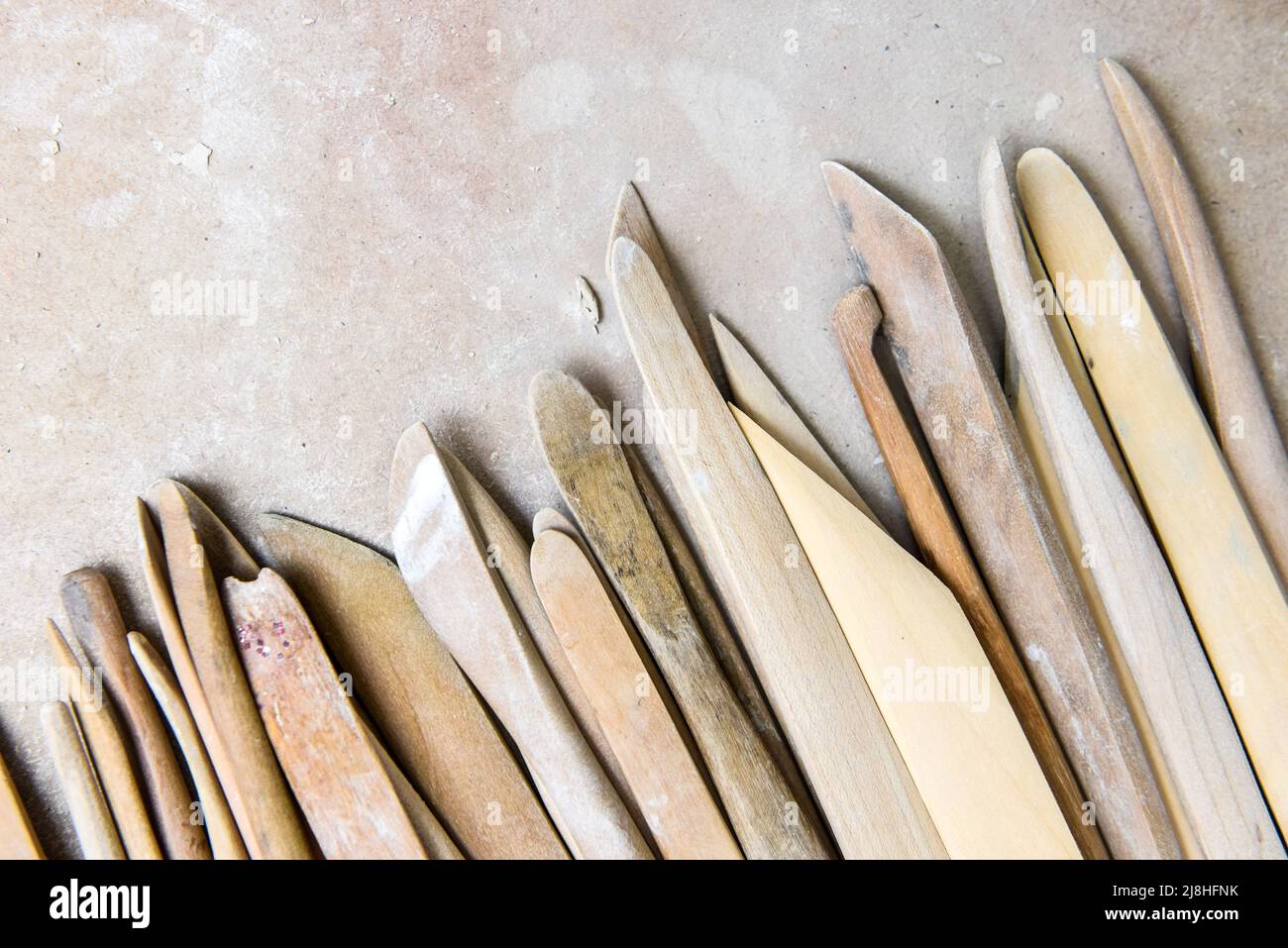 Wooden pottery tools set on a ceramics studio background Stock Photo